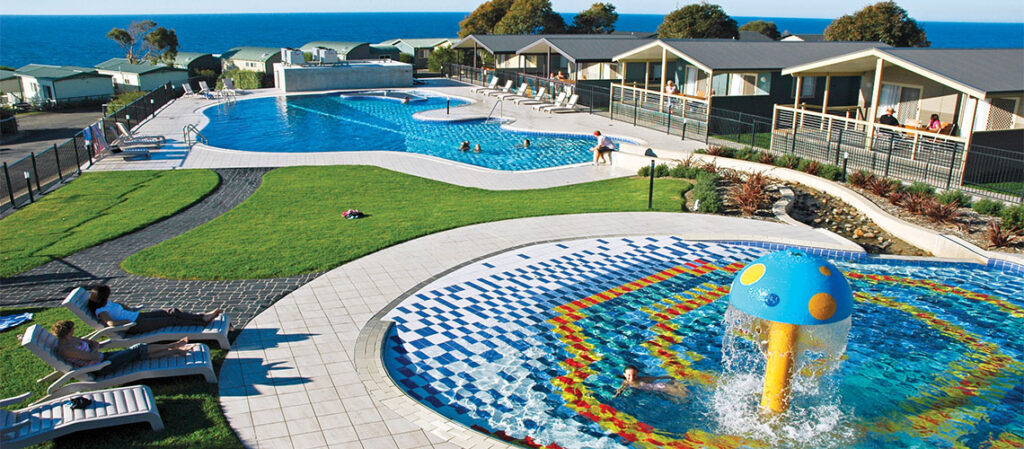 NRMA Merimbula Beach Holiday Park, Merimbula, New South Wales, This park boasts a fantastic playground with slides, climbing frames, and swings. It also offers direct access to the beach, making it an ideal choice for families.